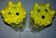 Retrac button bit